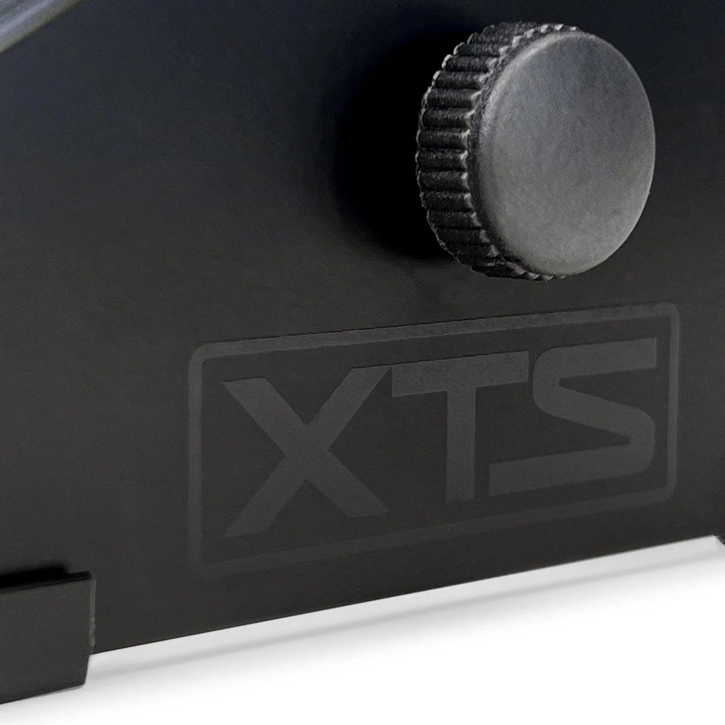 Close-up of the Analog Cases XTS Stand large keyboard stand logo with detailed branding and sturdy metal construction.