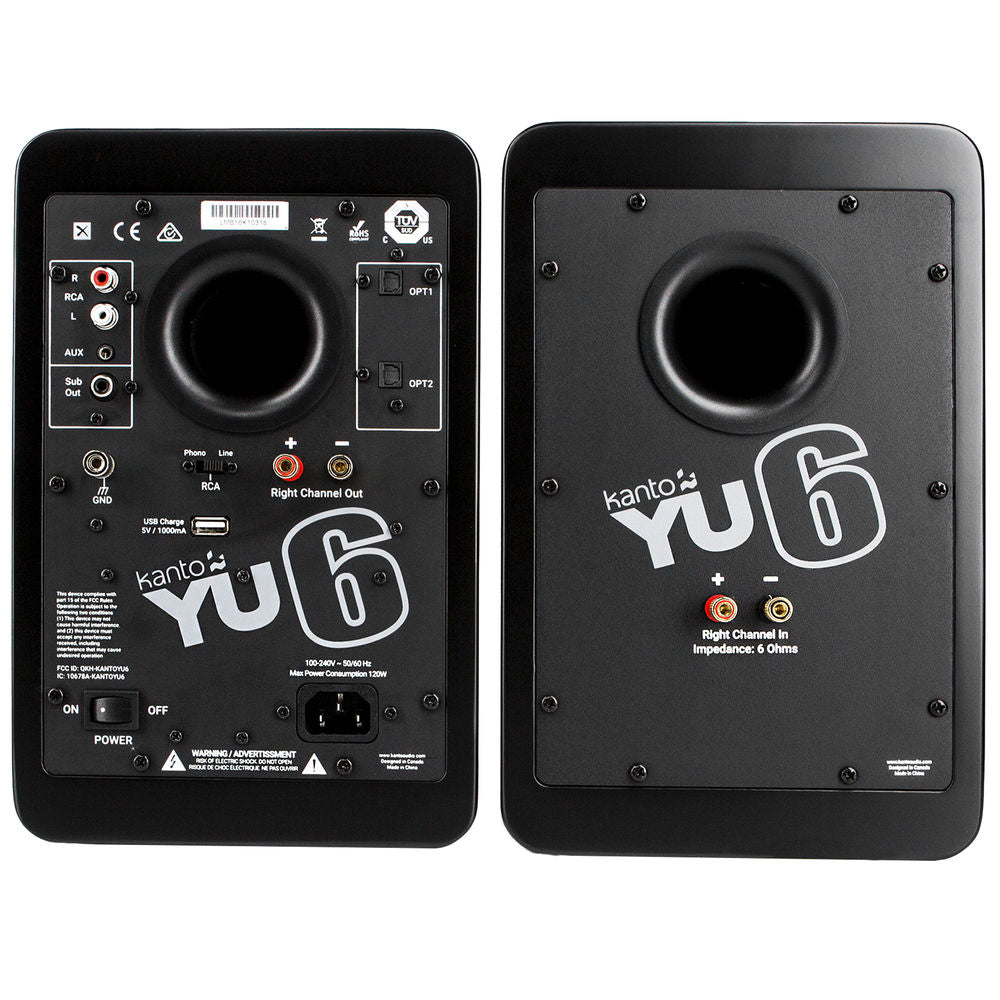 Kanto Audio YU6 wireless speakers with black finish, featuring sleek design and multiple connection ports, placed on a modern desk.