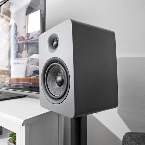 Kanto Audio YU6 wireless speakers with black finish, showing the compact design and control knobs on the top.
