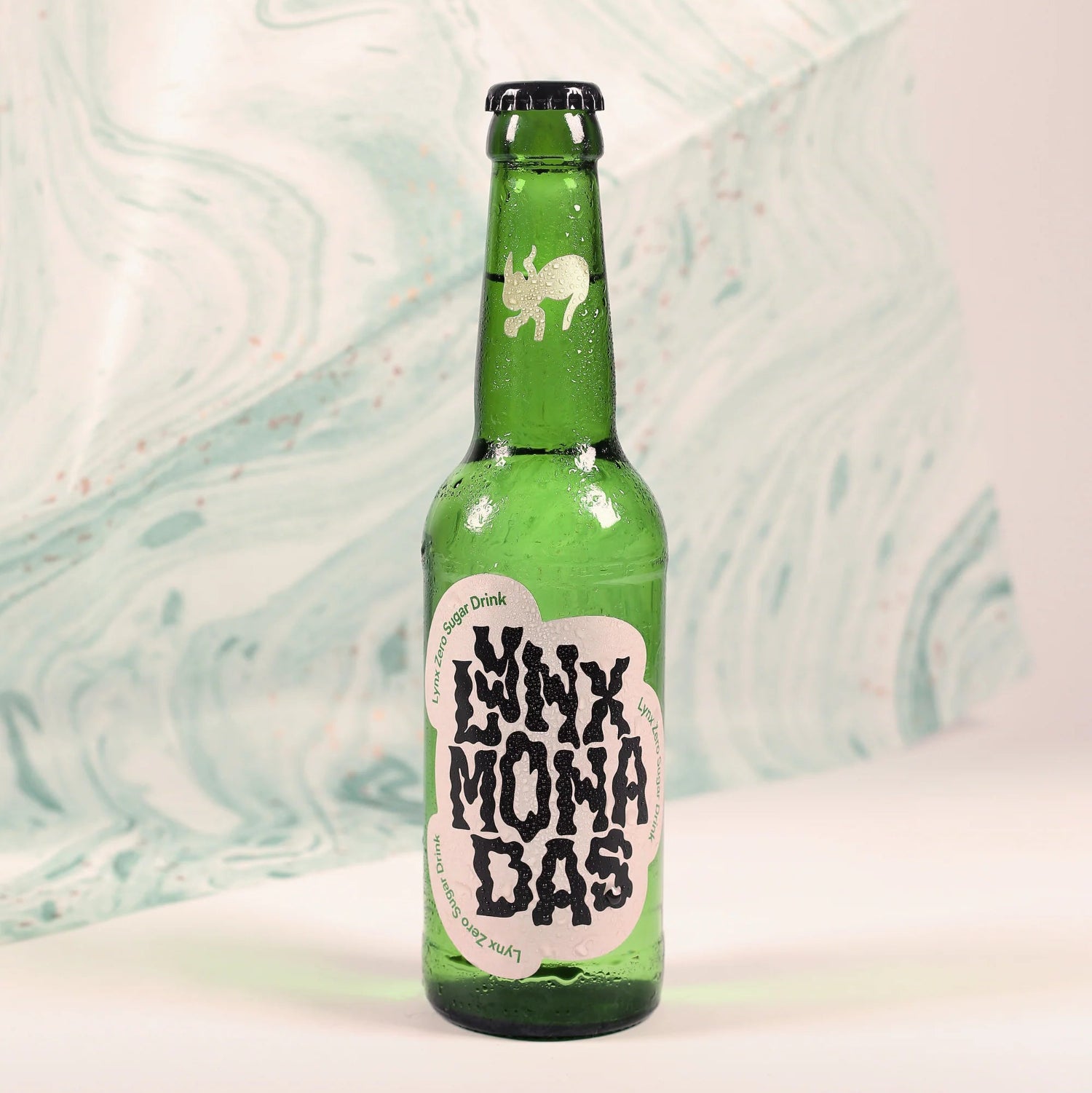 Green bottle with a label on a light background