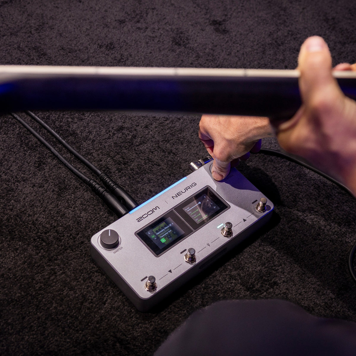 Zoom NEURIG footswitch in use while playing guitar