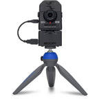 Zoom Q2n-4K video camera with protective case, featuring compact design and lens for high-quality audio and video recording.