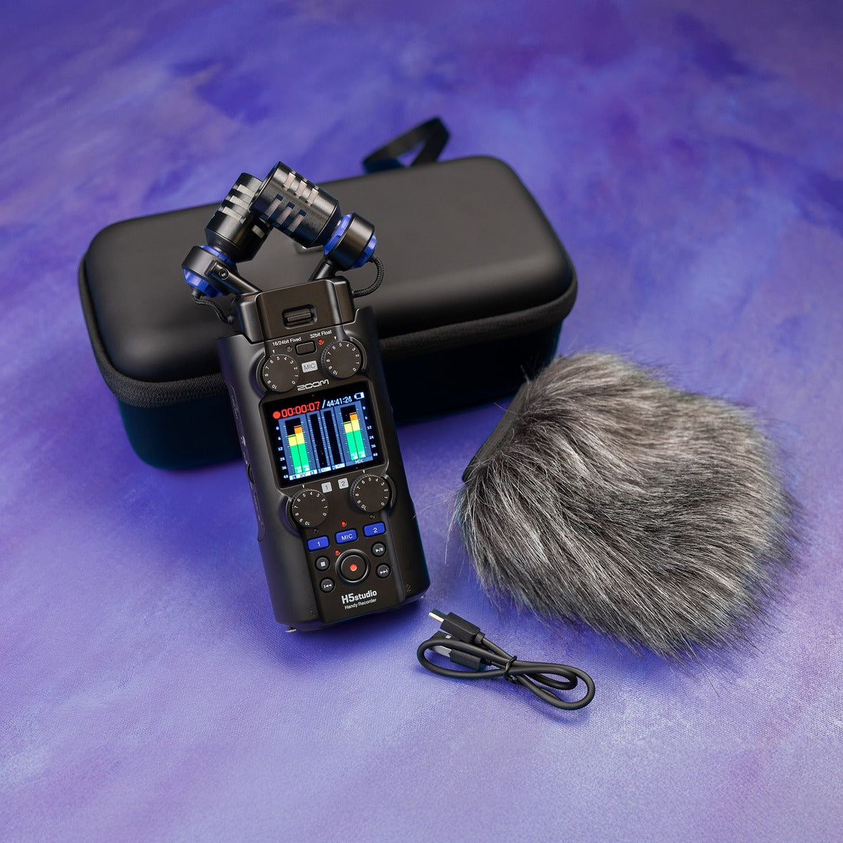 Zoom WSH-5s recorder accessory in a lifestyle setting, showing its compact design and portable features for audio recording.